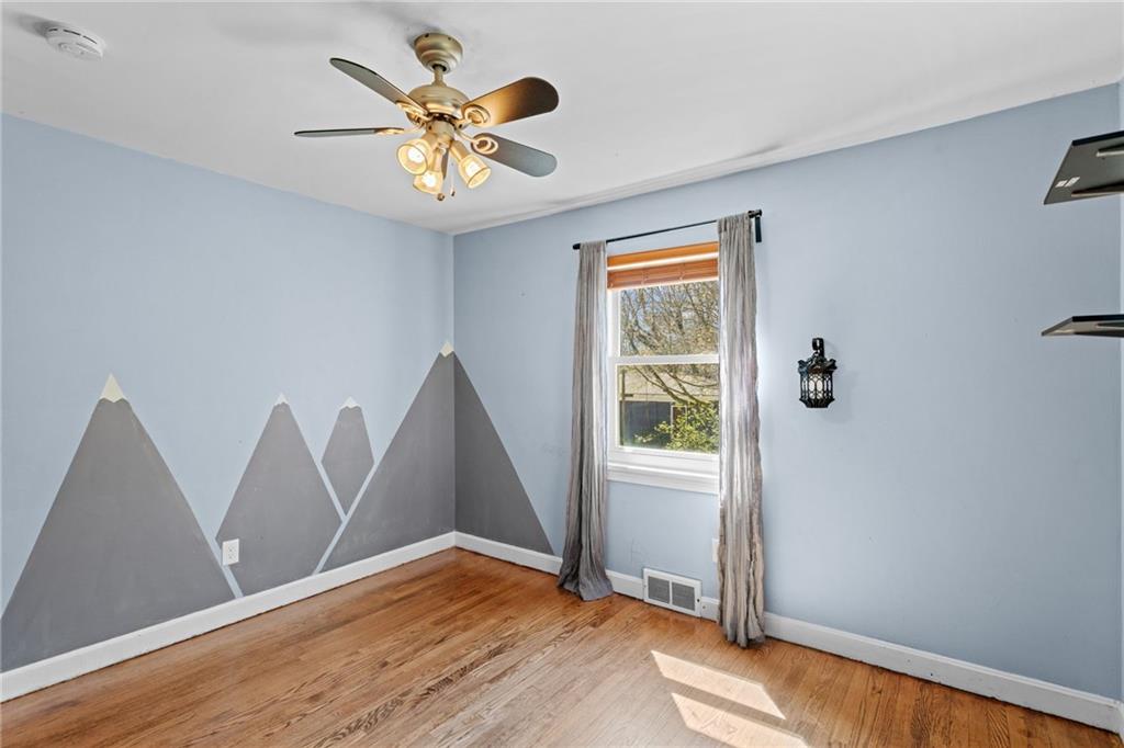 351 Engle Road Industry, PA 15052 - Photo 28 of 50 Bedroom 3 is located on the first floor and is well sized, featuring lovely hardwood floors.