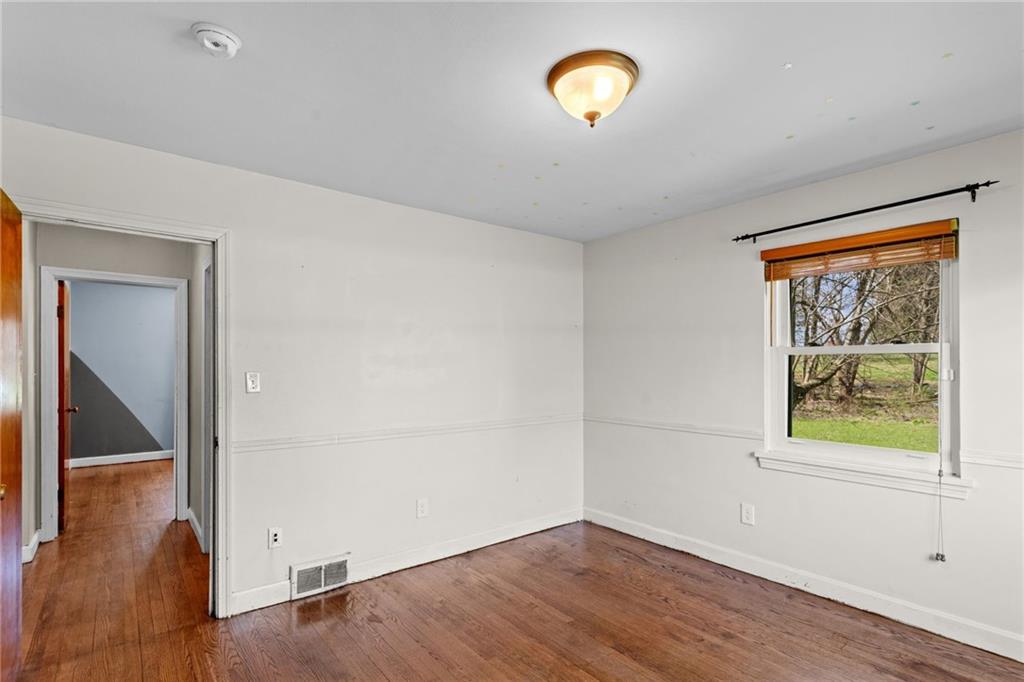 351 Engle Road Industry, PA 15052 - Photo 30 of 50 Bedroom 4 on the first floor also has hardwood floors and 2 closets.