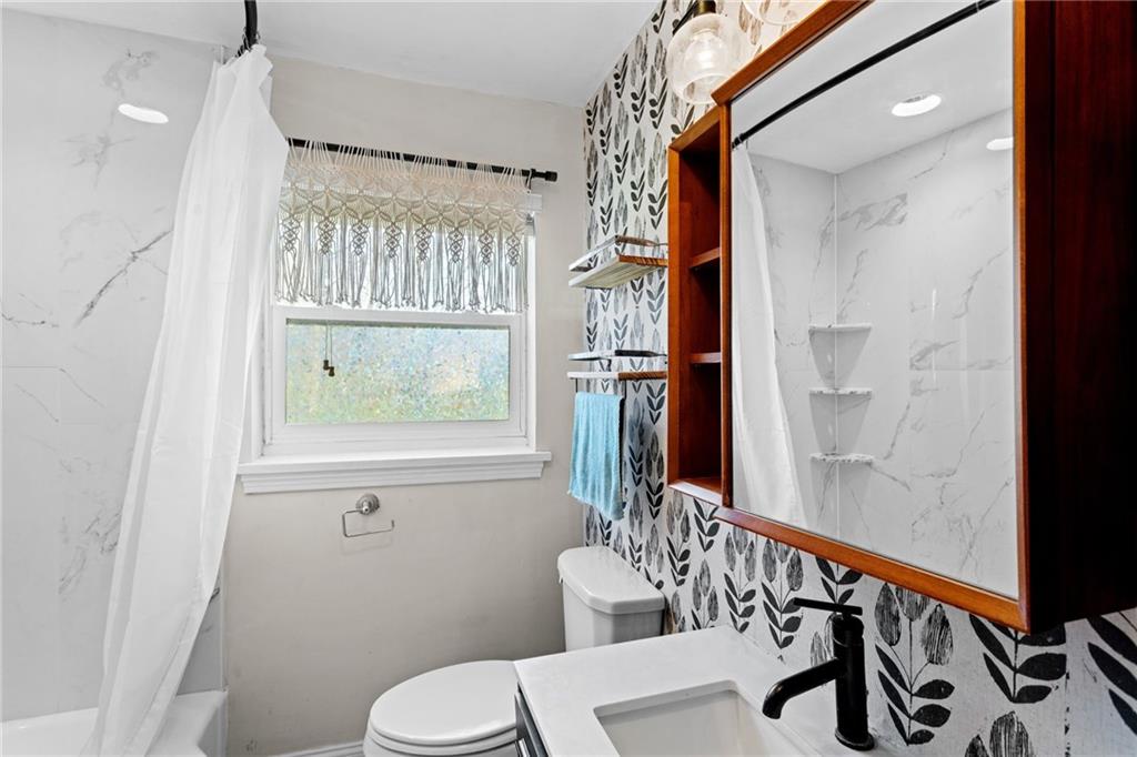 351 Engle Road Industry, PA 15052 - Photo 32 of 50 Located on the first floor, you'll find an updated full bathroom.