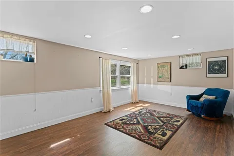 a living room with furniture and a rug