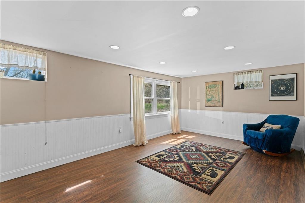 351 Engle Road Industry, PA 15052 - Photo 36 of 50 The finished basement provides a large family room area with windows to the pastures of the backyard.