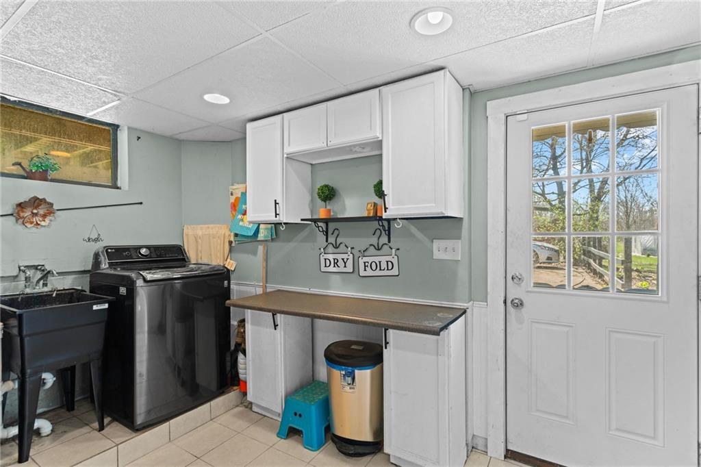 351 Engle Road Industry, PA 15052 - Photo 49 of 50 a kitchen with stainless steel appliances granite countertop a stove and a sink