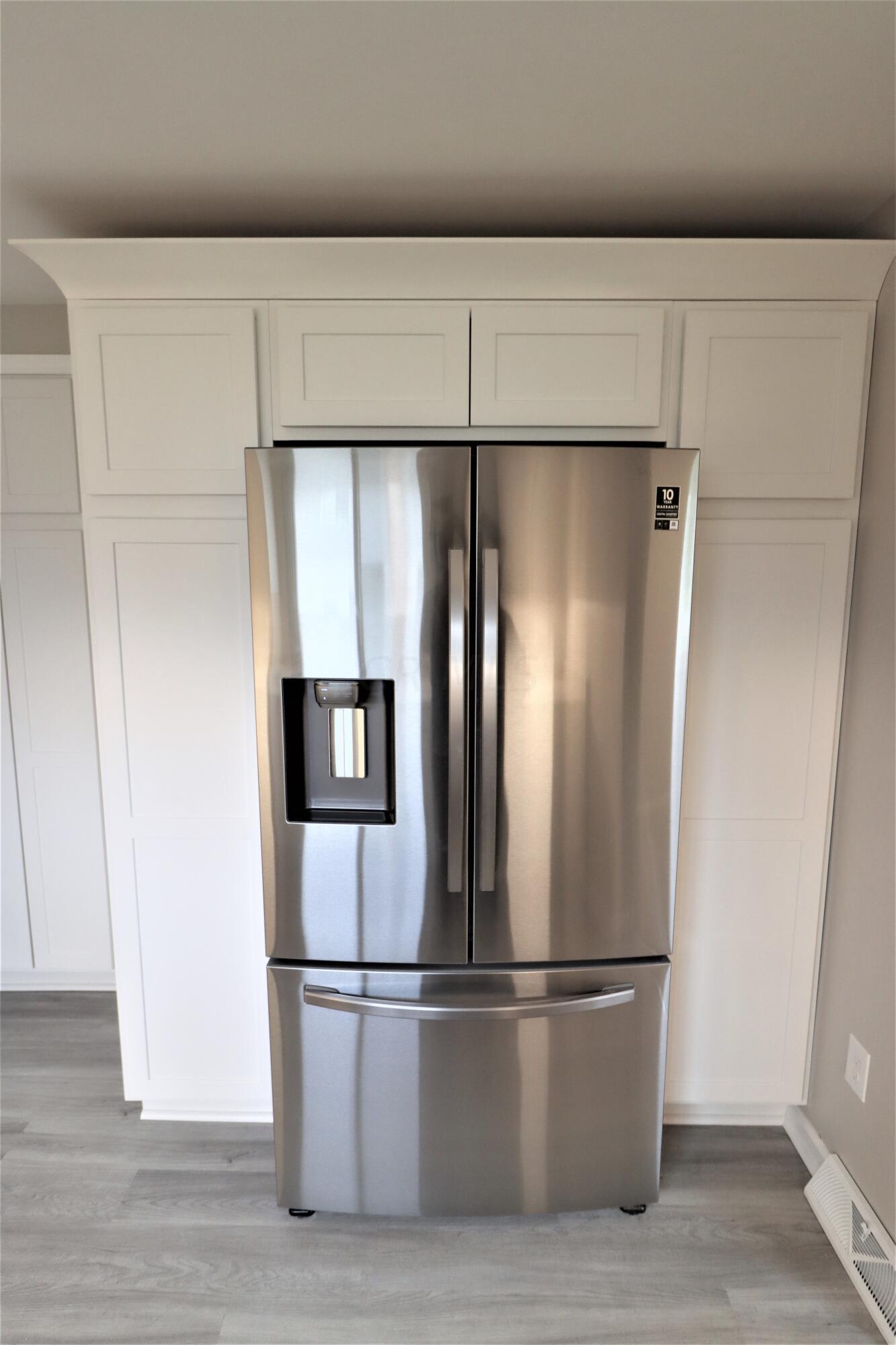 823 Ronson Avenue Gahanna, OH 43230 - Photo 6 of 37 Samsung Refrigerator with surrounding pantry cabinets