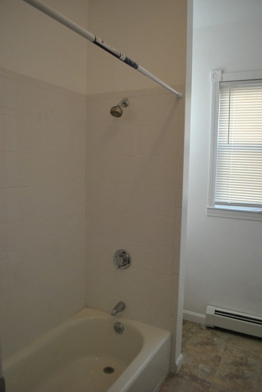 40 I Street, Unit 3 Boston, MA 02127 - Photo 8 of 11 a bathroom with a tub and a window