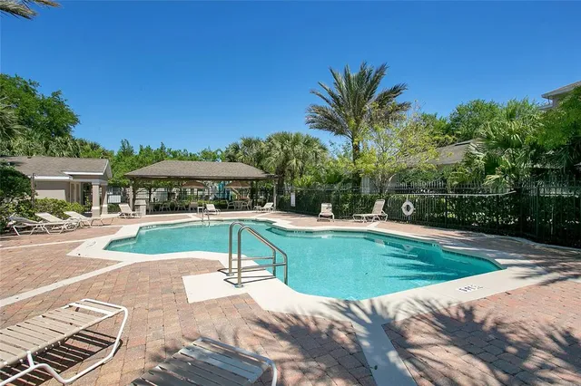 a view of a swimming pool with a patio