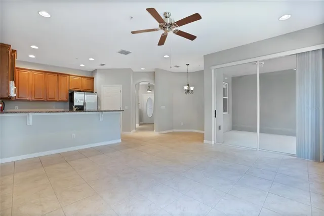 a view of a kitchen with a sink and a refrigerator