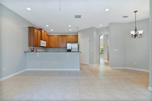 a view of a kitchen with a sink and cabinets