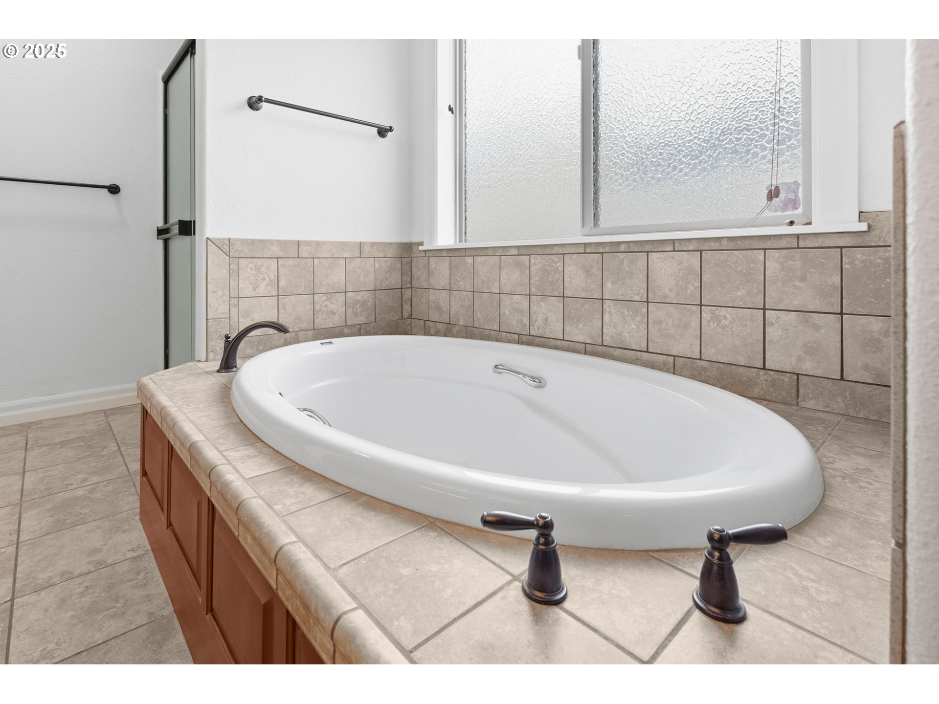 4879 Northeast Granite Avenue Albany, OR 97321 - Photo 12 of 47 a bathroom with a bathtub and shower