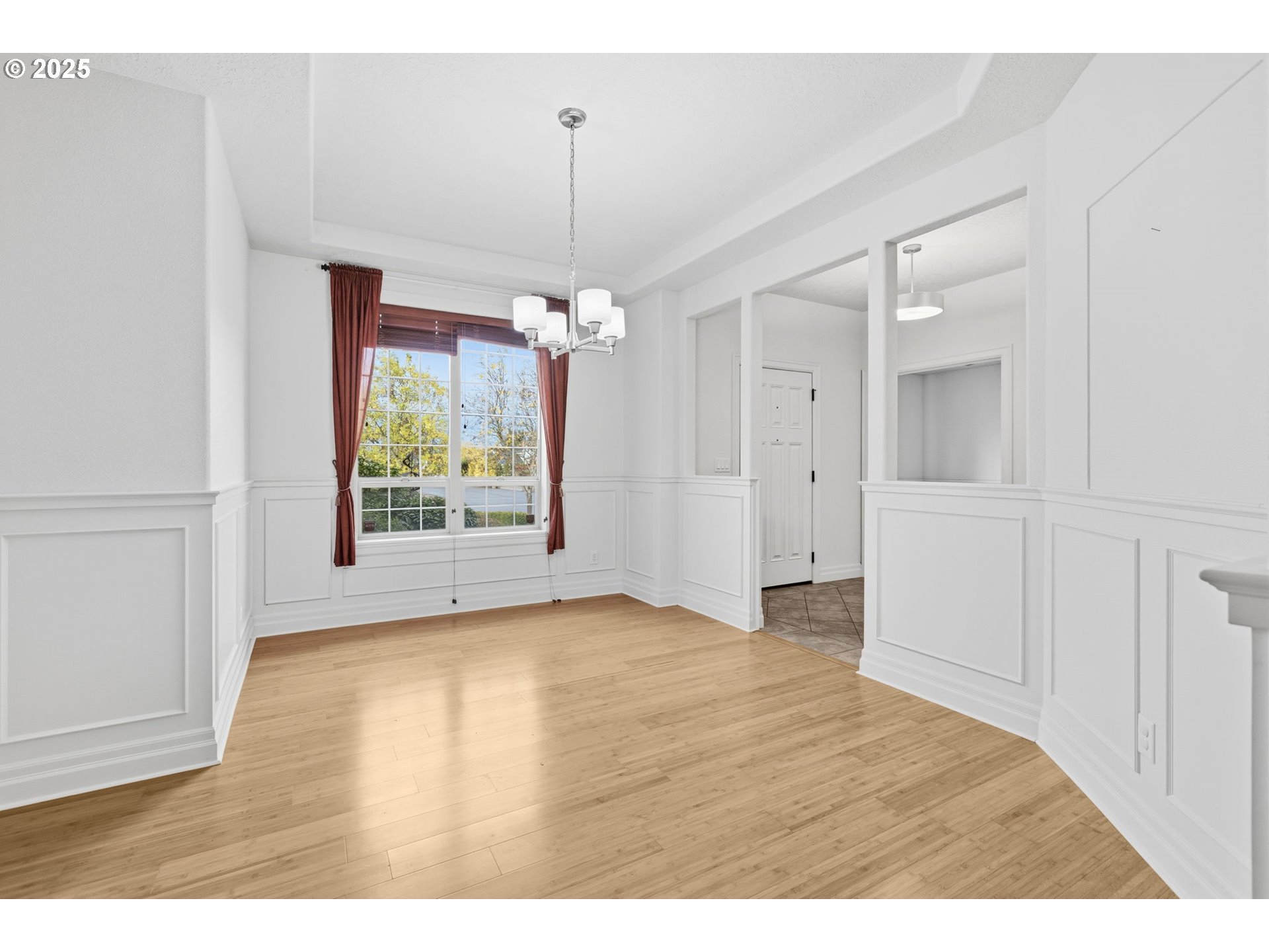 4879 Northeast Granite Avenue Albany, OR 97321 - Photo 2 of 47 a view of an empty room with window and wooden floor