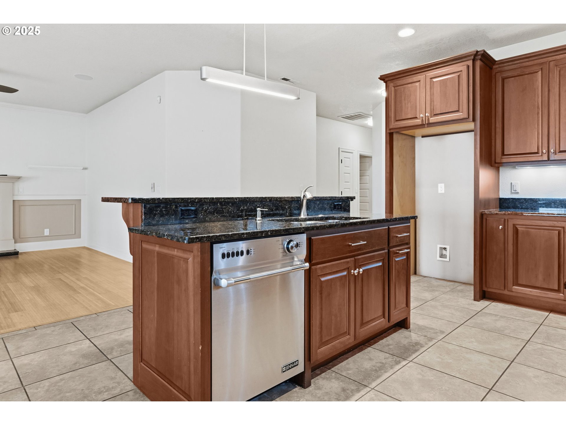 4879 Northeast Granite Avenue Albany, OR 97321 - Photo 27 of 47 a kitchen with stainless steel appliances granite countertop a stove a sink and a refrigerator