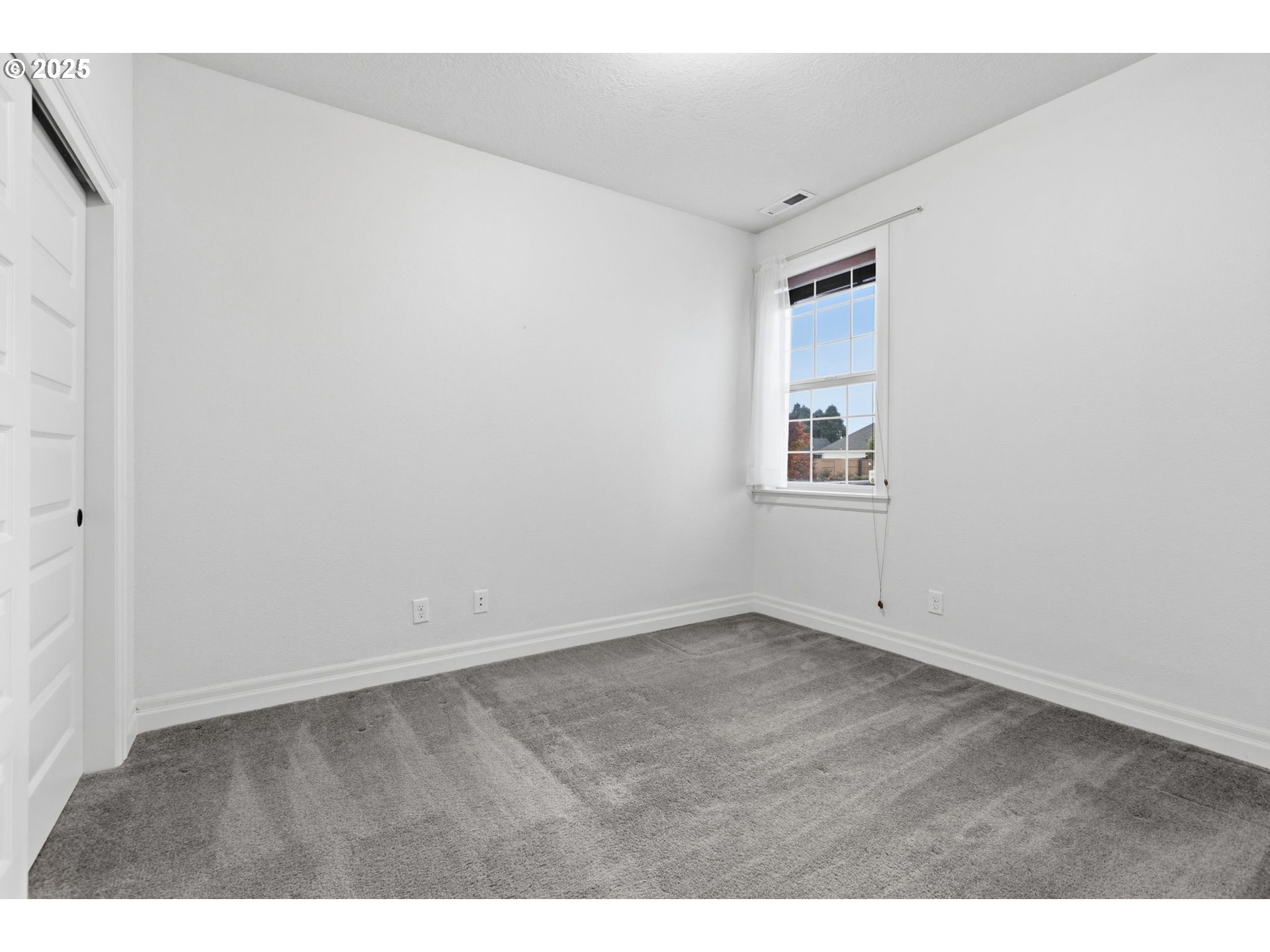 4879 Northeast Granite Avenue Albany, OR 97321 - Photo 39 of 47 an empty room with windows