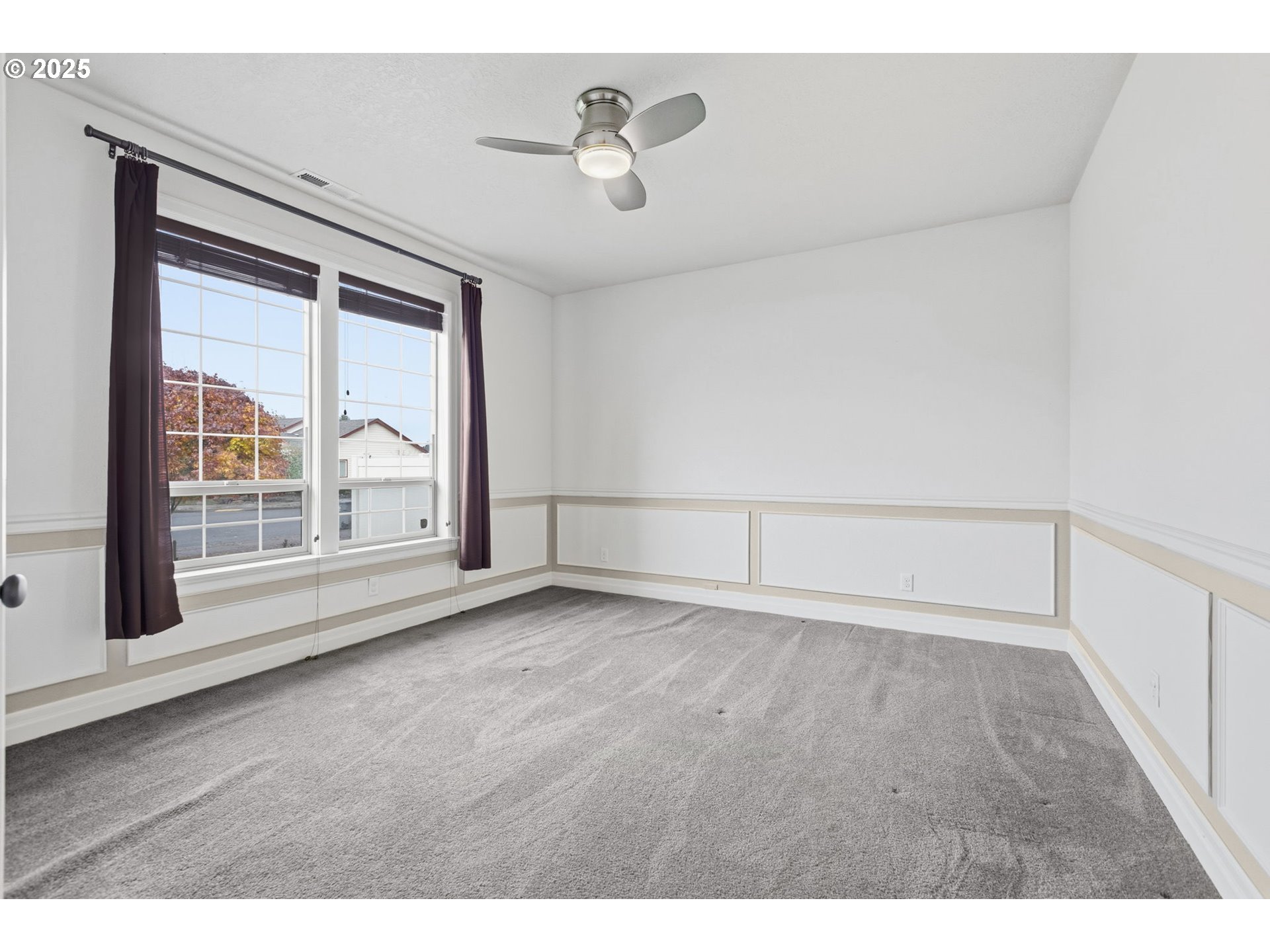 4879 Northeast Granite Avenue Albany, OR 97321 - Photo 4 of 47 a view of an empty room with a window