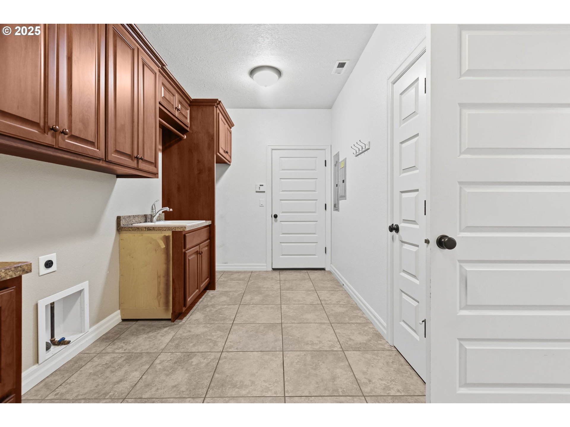 4879 Northeast Granite Avenue Albany, OR 97321 - Photo 41 of 47 a view of a kitchen with storage and utility