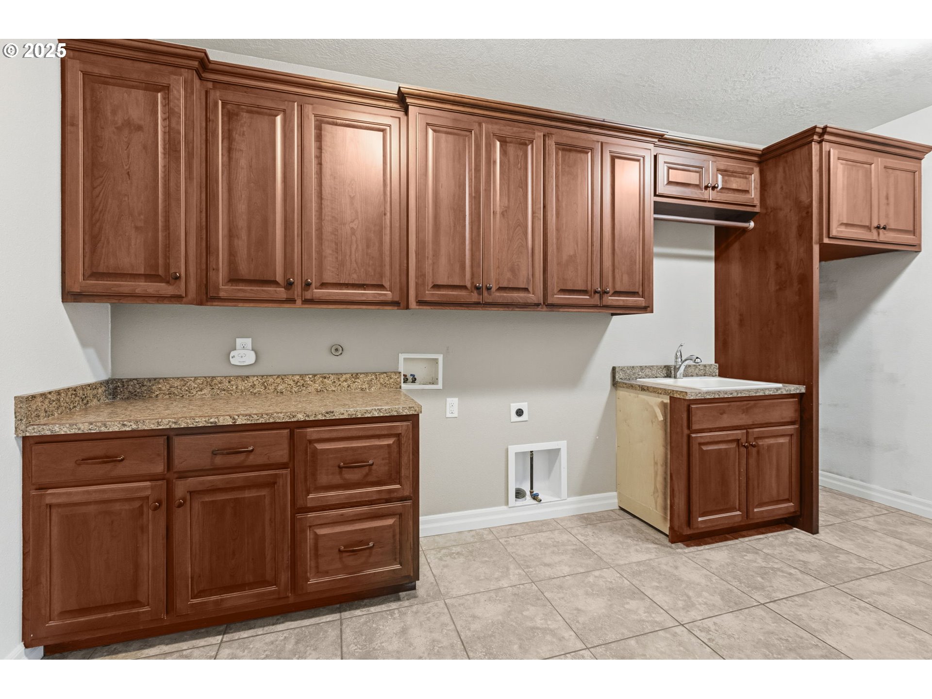 4879 Northeast Granite Avenue Albany, OR 97321 - Photo 42 of 47 a kitchen with stainless steel appliances granite countertop a stove refrigerator and cabinets