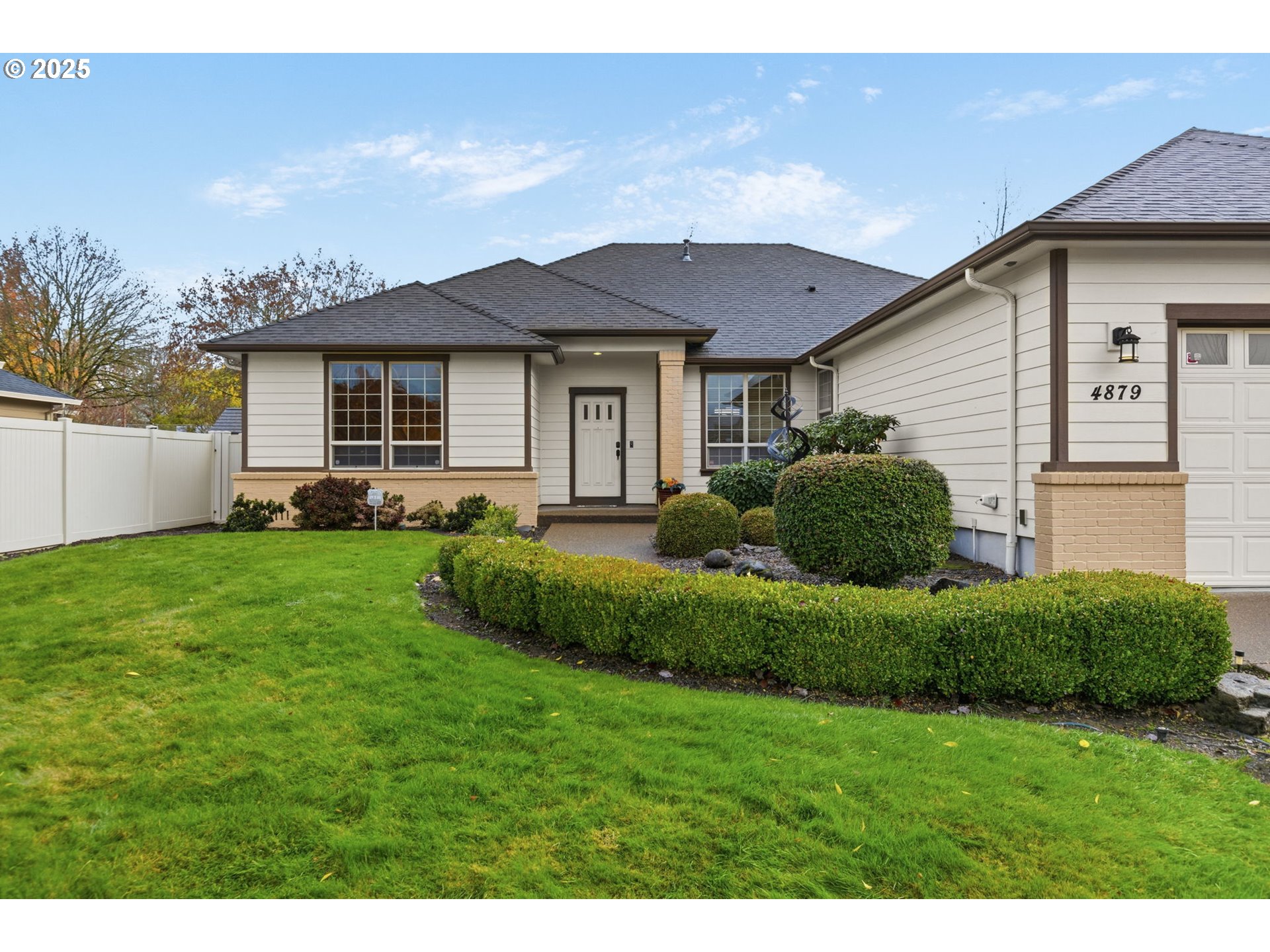 4879 Northeast Granite Avenue Albany, OR 97321 - Photo 44 of 47 a front view of a house with a garden and plants