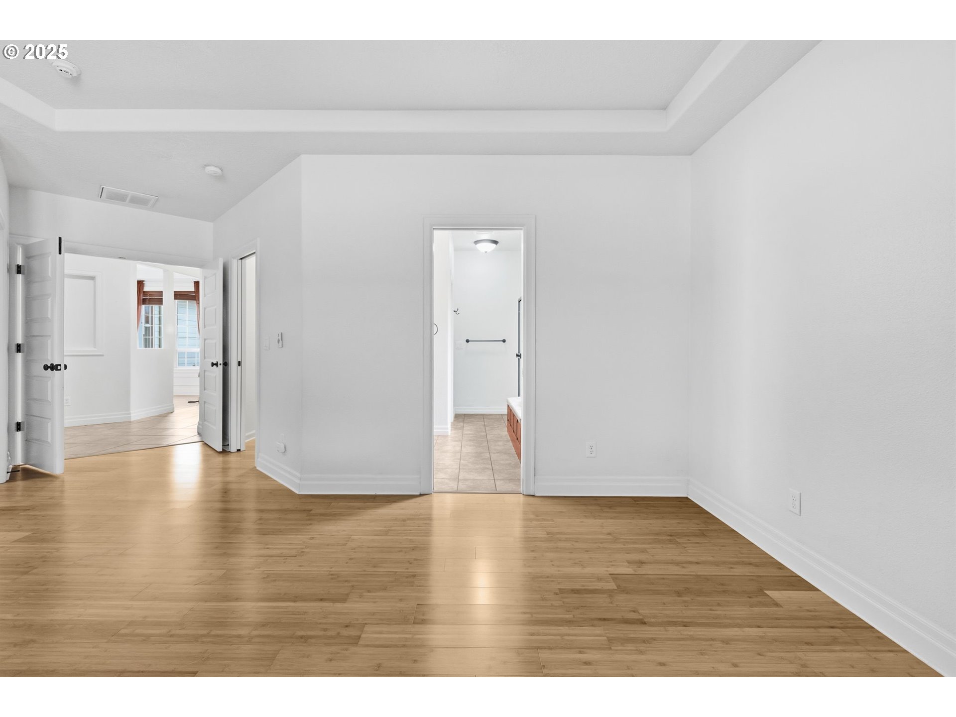 4879 Northeast Granite Avenue Albany, OR 97321 - Photo 10 of 47 a view of an empty room with wooden floor