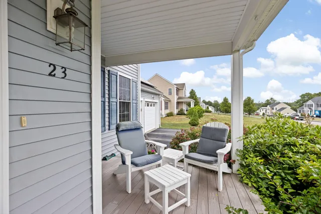 a view of a patio with couches chairs and potted plants
