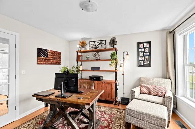 a workspace with furniture and window