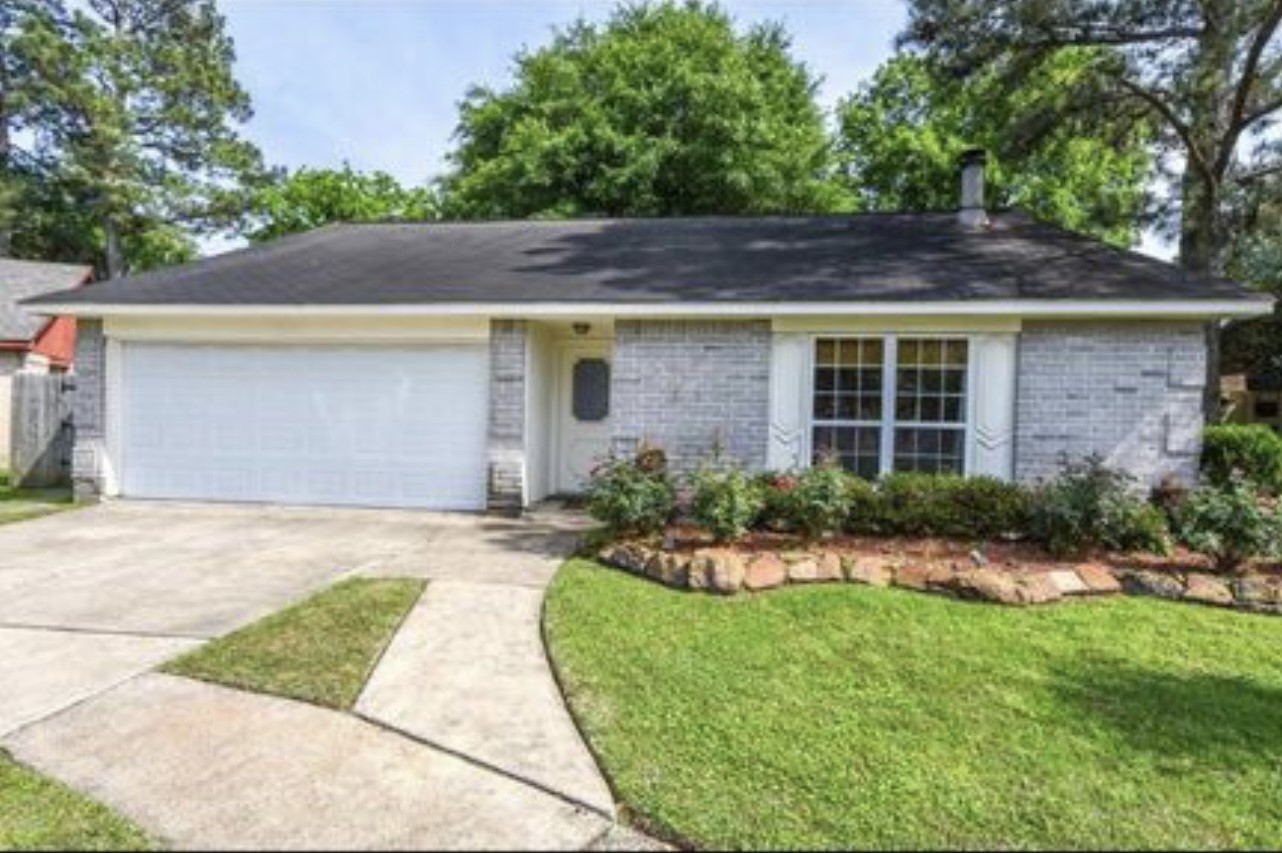 5906 Flower Gate Drive Spring, TX 77373 - Photo 1 of 7 a front view of a house with a yard and potted plants