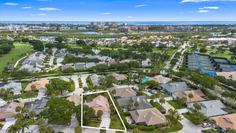 an aerial view of residential houses with outdoor space and river
