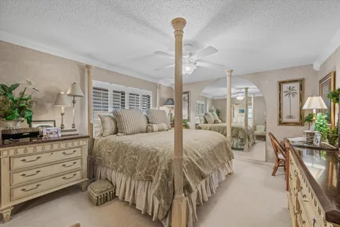 a bed room with a bed and a dresser