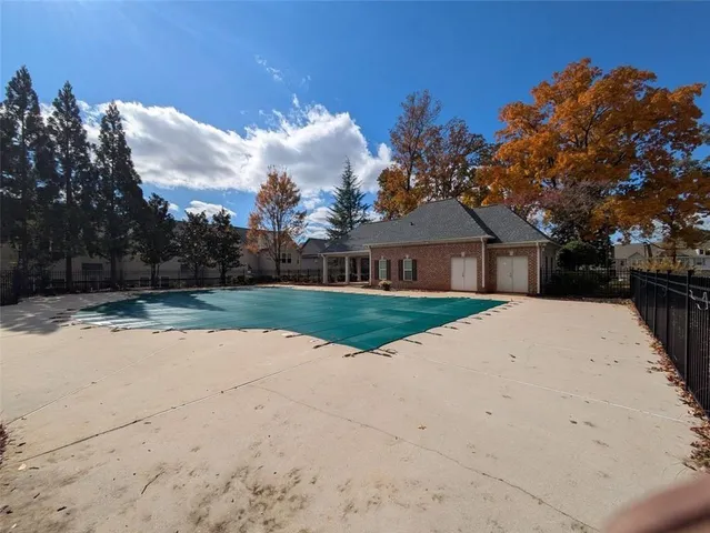 a view of house with outdoor space and trees around