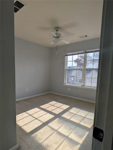 a view of an empty room and window