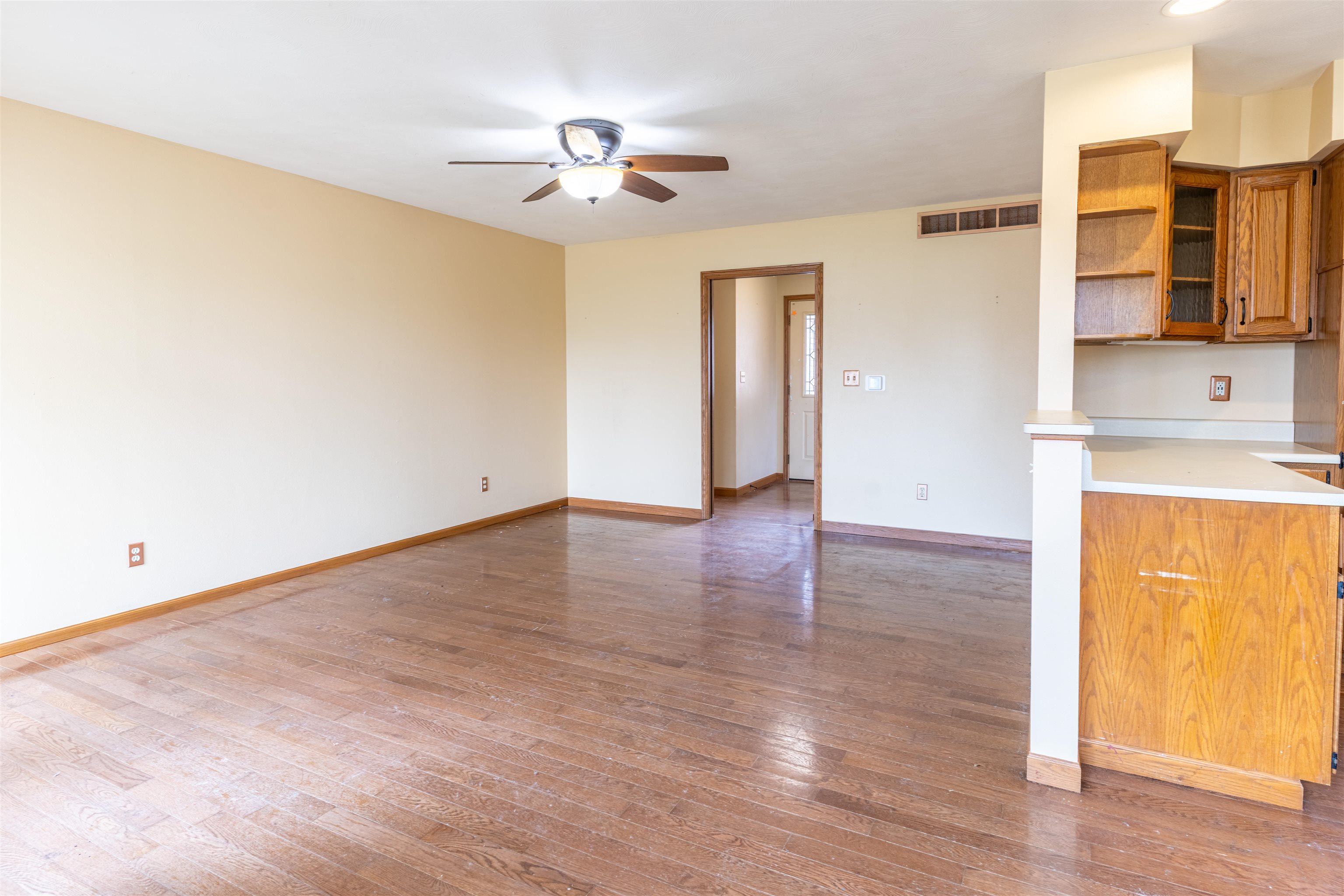 151 North Fox Run Lane Byron, IL 61010 - Photo 11 of 37 a view of empty room with wooden floor and fan