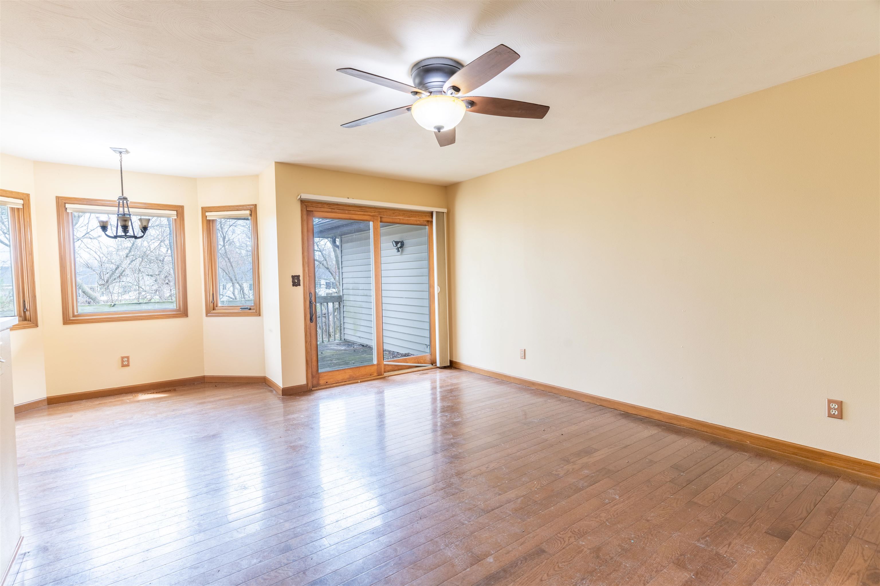 151 North Fox Run Lane Byron, IL 61010 - Photo 13 of 37 a view of an empty room with window and wooden floor