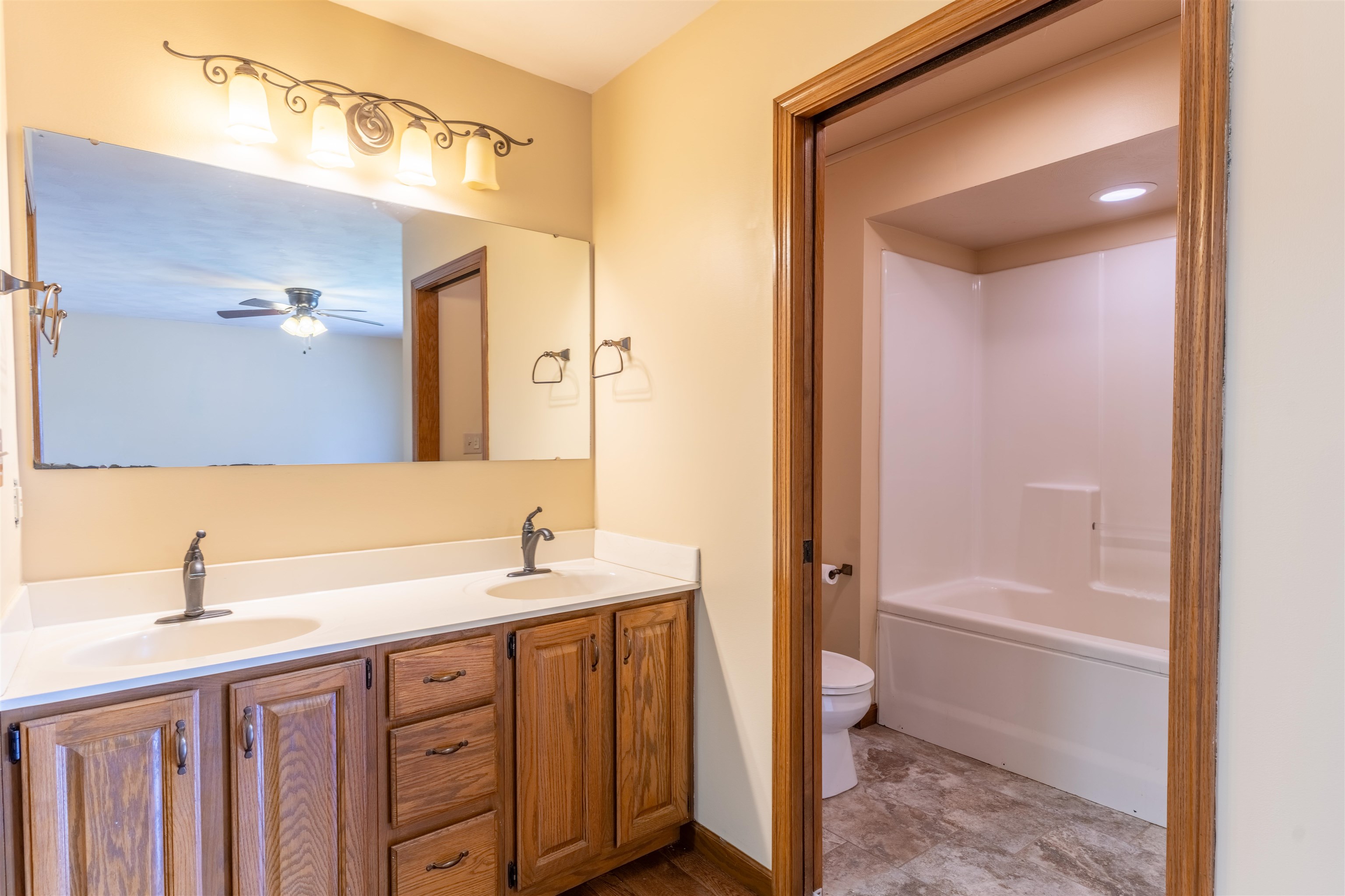 151 North Fox Run Lane Byron, IL 61010 - Photo 16 of 37 a bathroom with a double vanity sink and a mirror