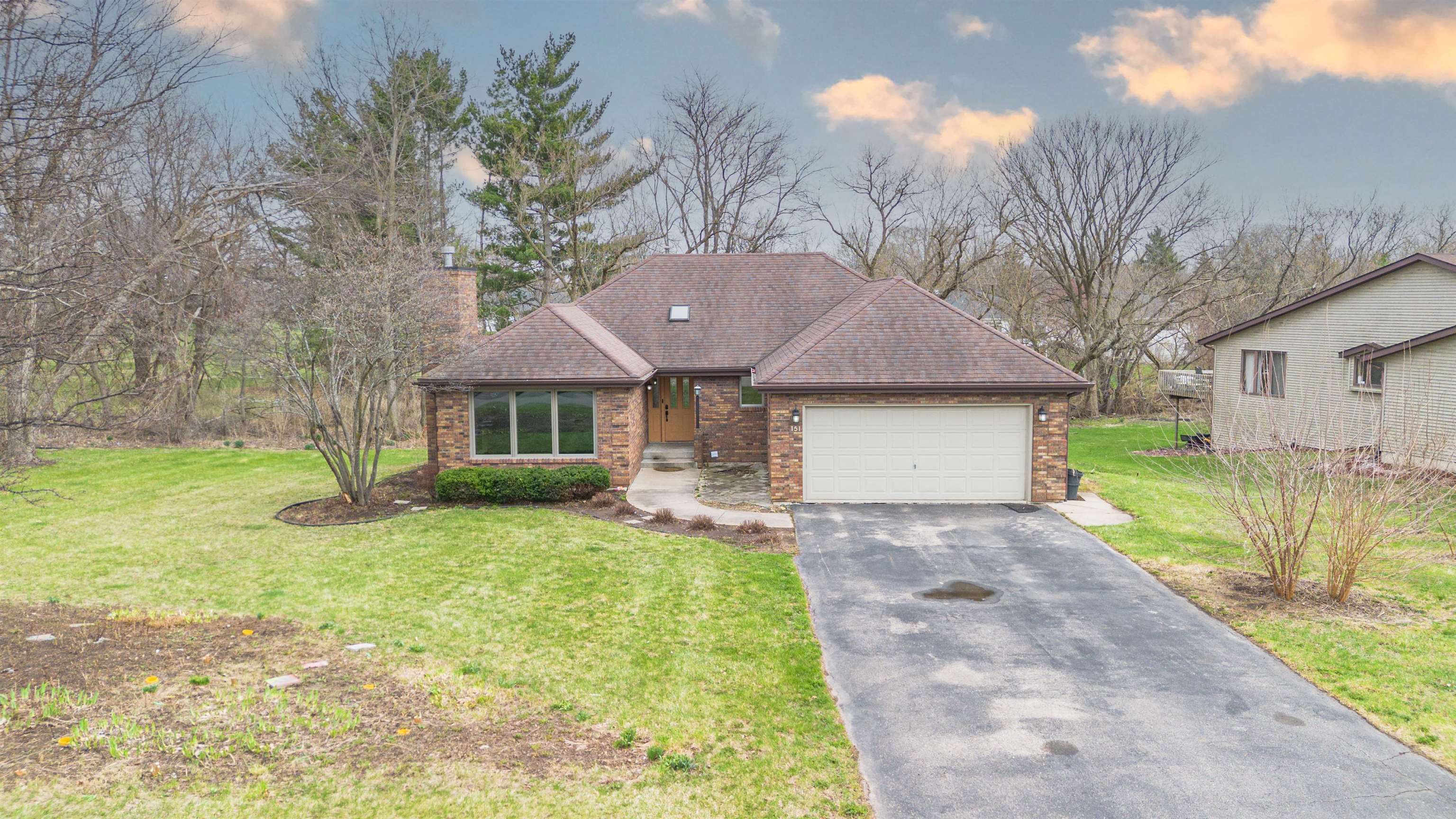 151 North Fox Run Lane Byron, IL 61010 - Photo 2 of 37 a front view of a house with a yard and garage
