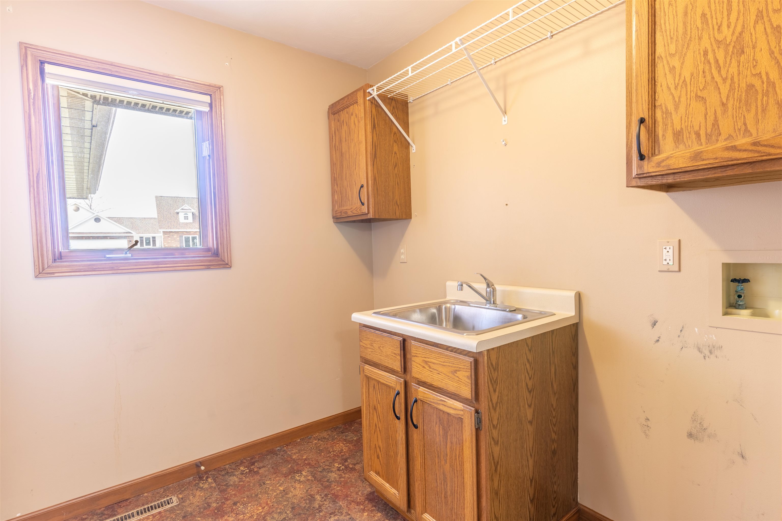 151 North Fox Run Lane Byron, IL 61010 - Photo 31 of 37 a utility room with a sink a vanity and a window