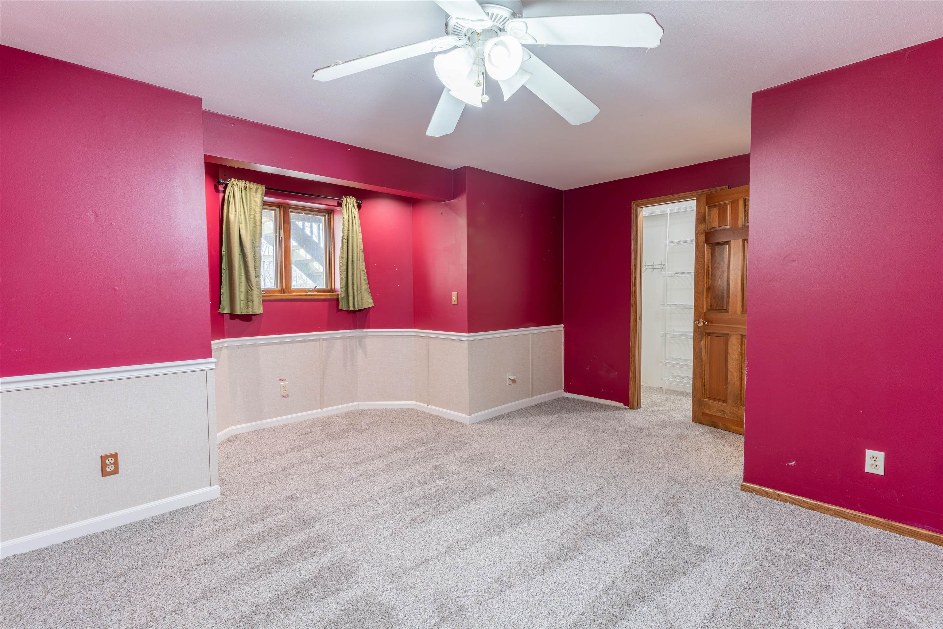 151 North Fox Run Lane Byron, IL 61010 - Photo 32 of 37 a view of an empty room with window chandelier fan and fire place