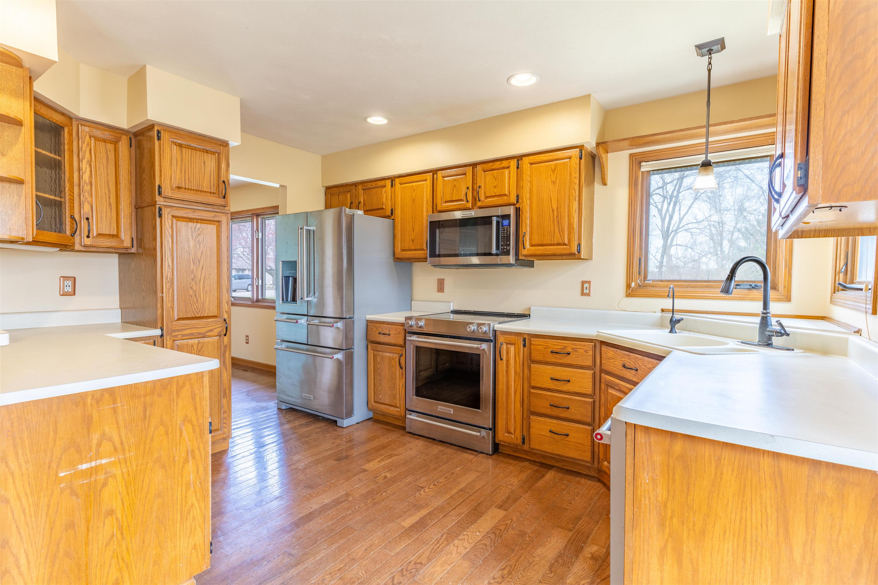 151 North Fox Run Lane Byron, IL 61010 - Photo 7 of 37 a kitchen with stainless steel appliances granite countertop a sink stove and refrigerator