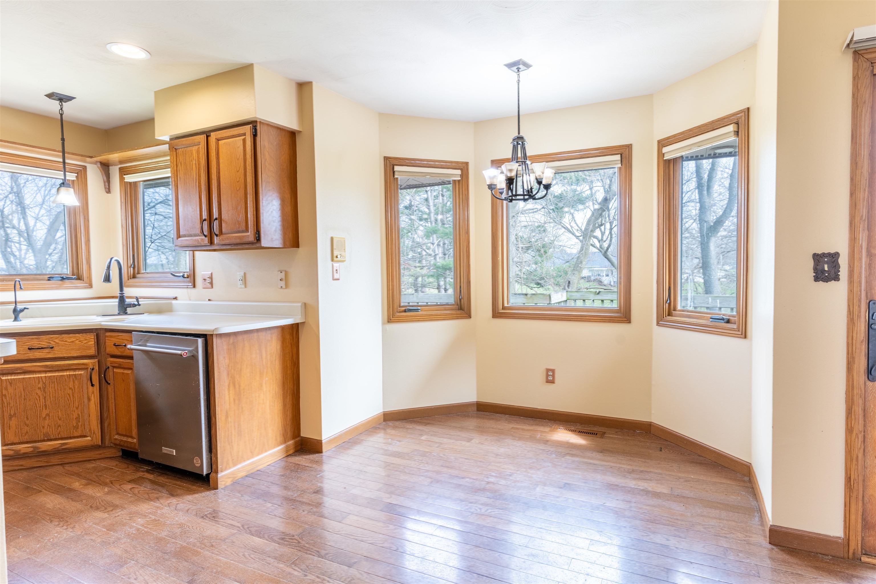 151 North Fox Run Lane Byron, IL 61010 - Photo 10 of 37 a view of kitchen with wooden floor and window