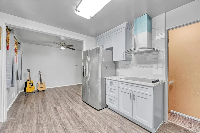 a kitchen with stainless steel appliances a refrigerator and a stove