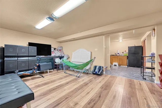 a room with furniture and a flat screen tv