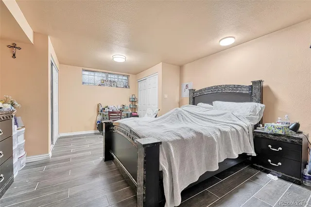 a bedroom with a bed and a cabinets