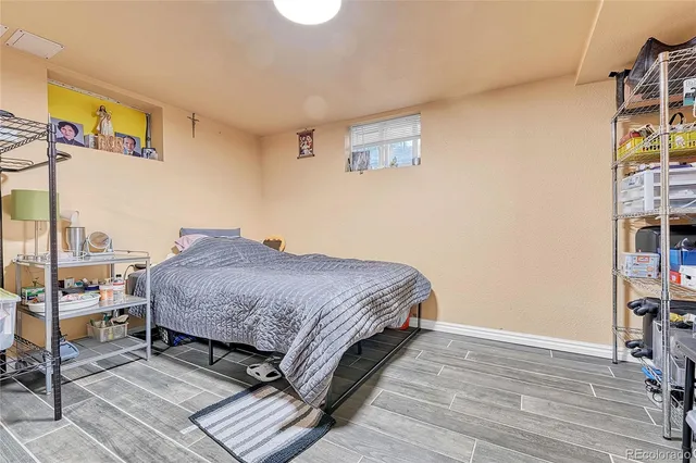 a bedroom with a bed and a table