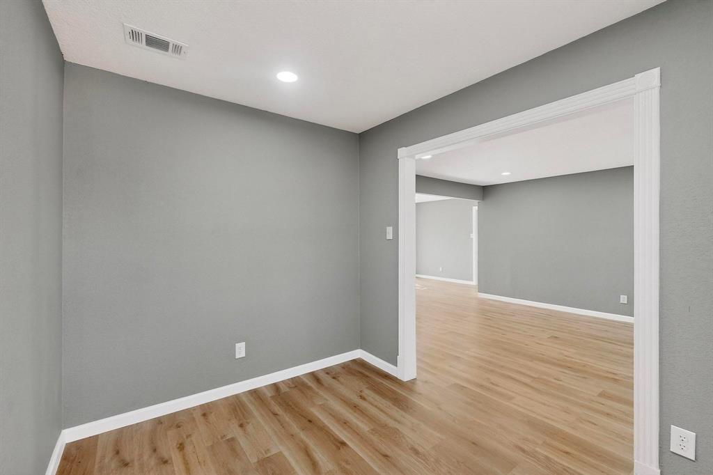 3442 Tioga Street Dallas, TX 75241 - Photo 11 of 28 a view of an empty room with wooden floor