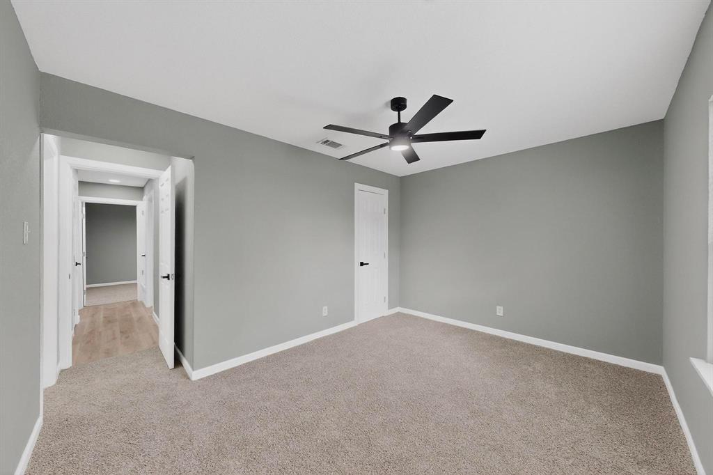 3442 Tioga Street Dallas, TX 75241 - Photo 14 of 28 a view of a livingroom with a ceiling fan and window