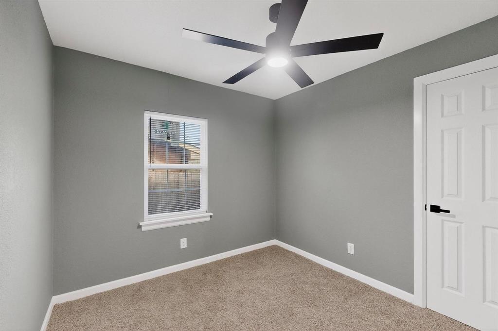 3442 Tioga Street Dallas, TX 75241 - Photo 17 of 28 an empty room with window and ceiling fan