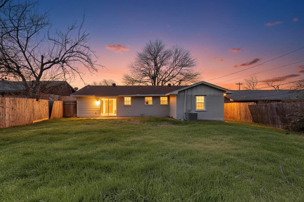 3442 Tioga Street Dallas, TX 75241 - Photo 24 of 28 a view of a yard in front of a house with large trees