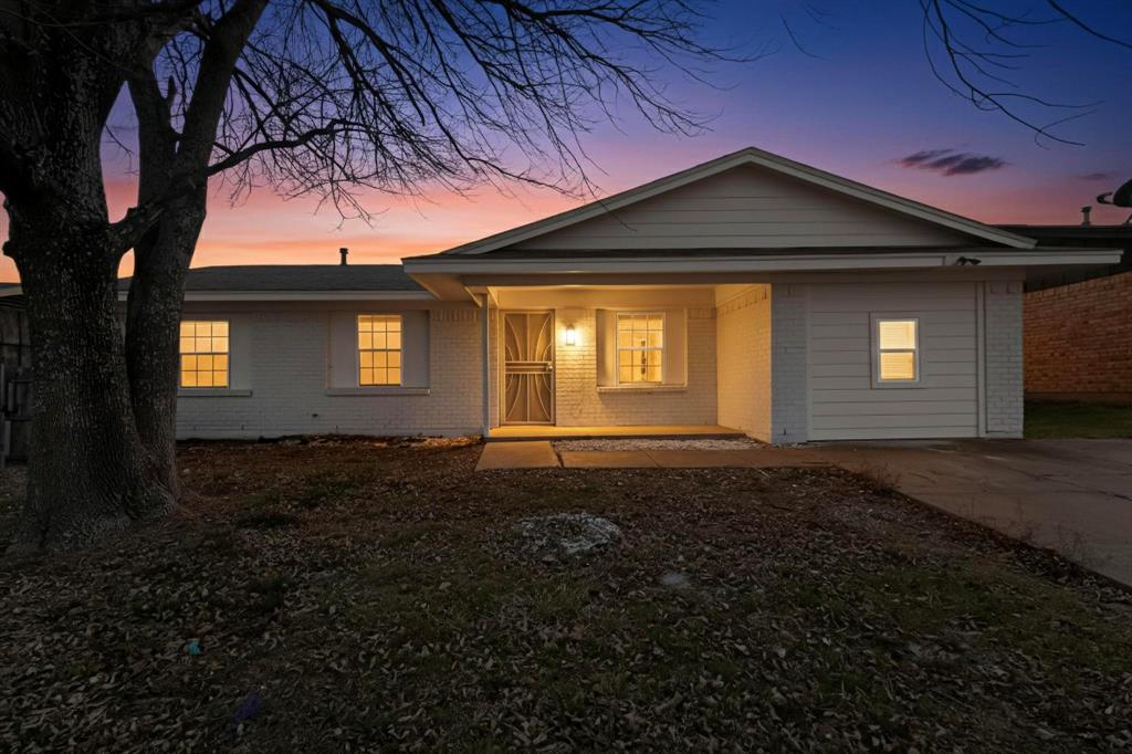 3442 Tioga Street Dallas, TX 75241 - Photo 4 of 28 a front view of a house with a yard