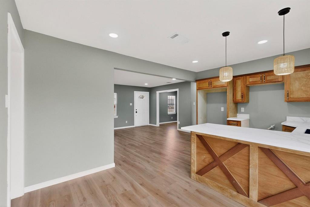 3442 Tioga Street Dallas, TX 75241 - Photo 7 of 28 a view of a dining room with furniture and wooden floor
