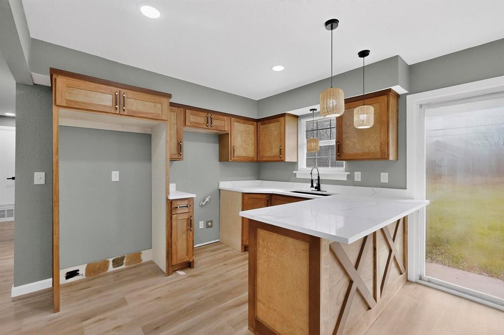 3442 Tioga Street Dallas, TX 75241 - Photo 9 of 28 a view of a kitchen cabinets a sink and wooden floor