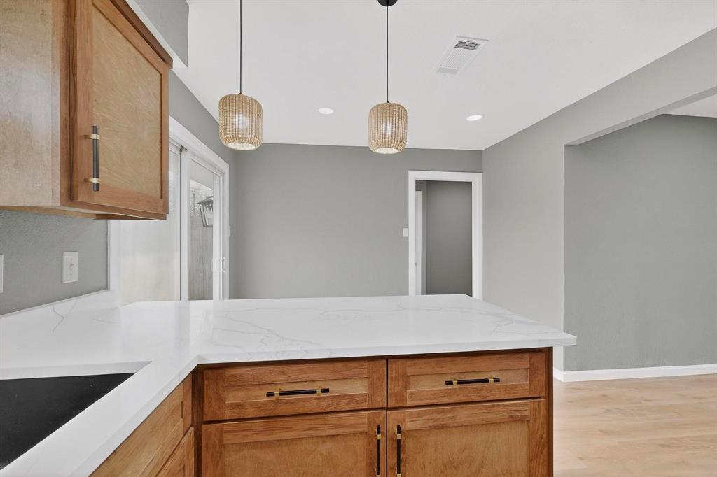 3442 Tioga Street Dallas, TX 75241 - Photo 10 of 28 a view of cabinets and wooden floor