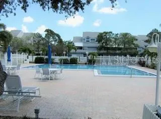 a view of a swimming pool with a patio