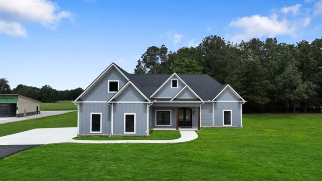 a front view of a house with a yard