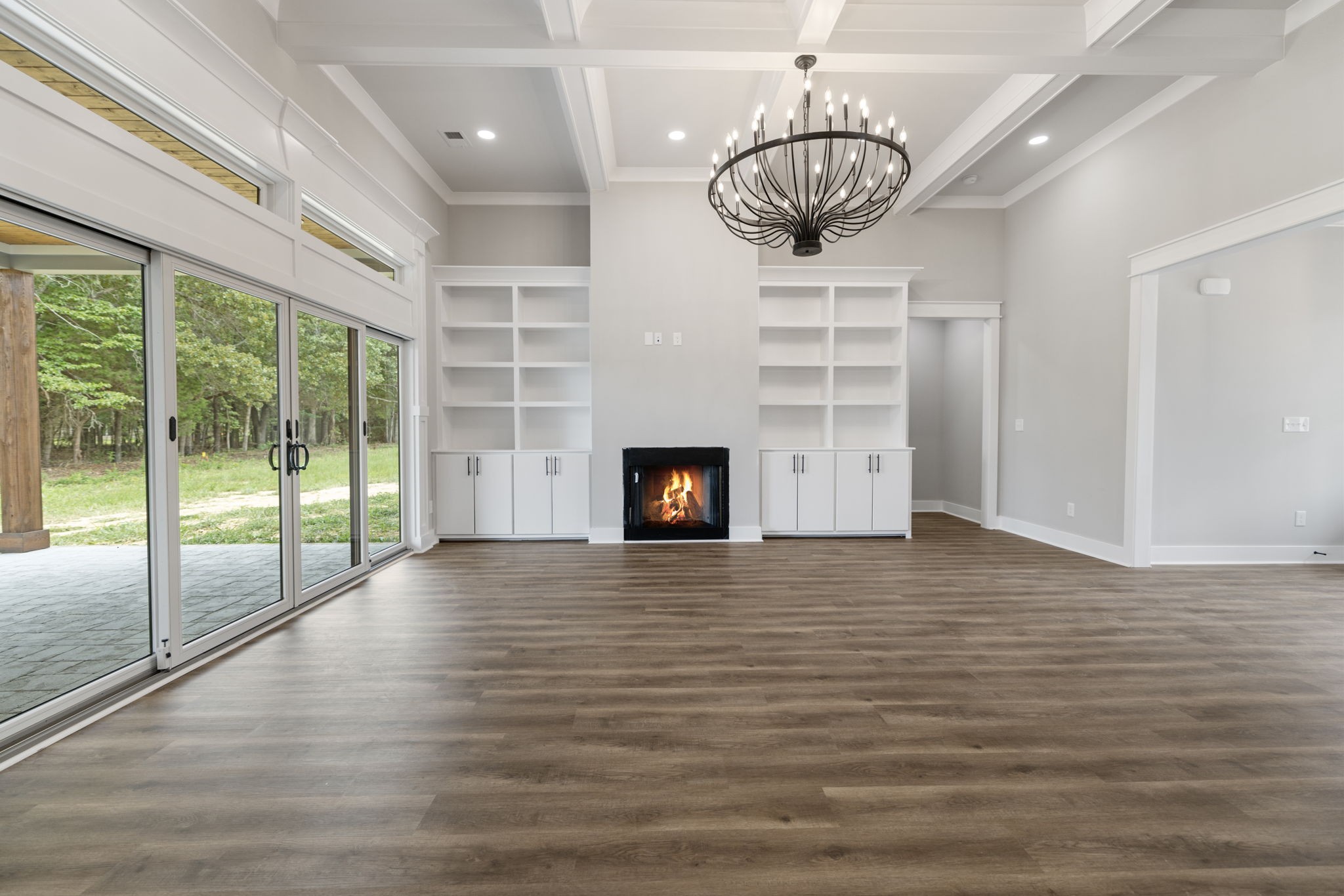 887 Ovoca Lake Road Tullahoma, TN 37388 - Photo 13 of 58 a view of empty room with wooden floor and fireplace